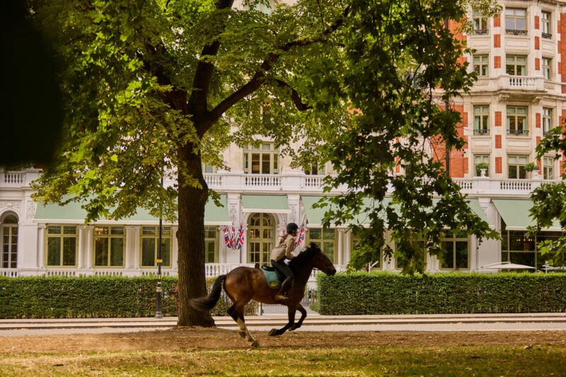 Picture Women on a horse galloping in front of Mandarin Oriental Hyde Park London
